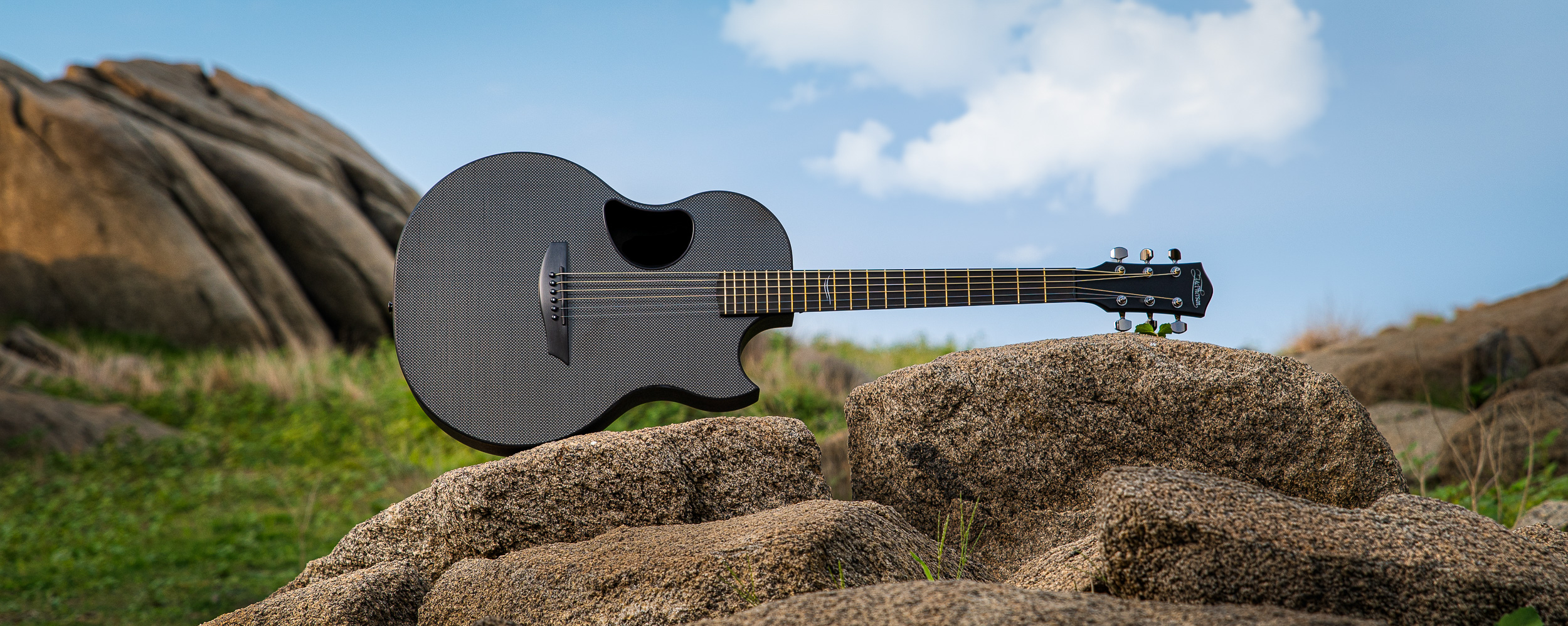 Carbon acoustic outlet guitar